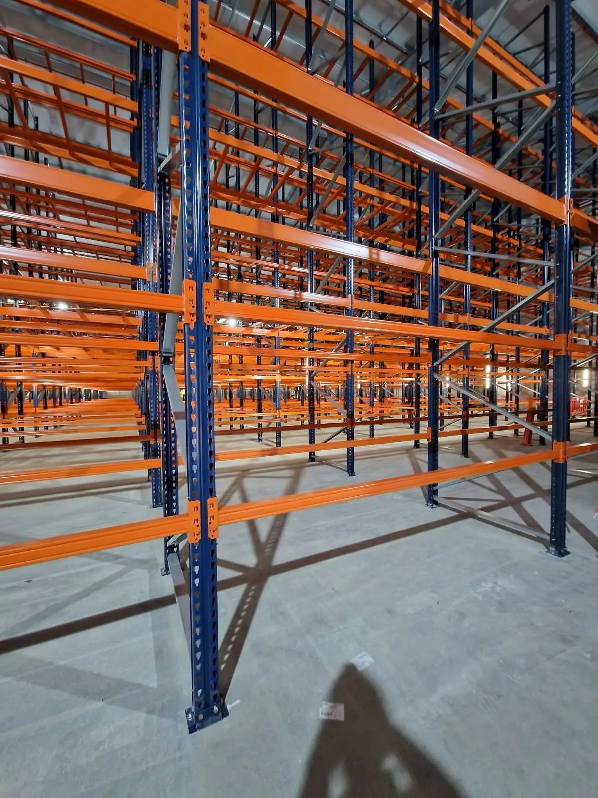 Runs of pallet racking, several beam levels high